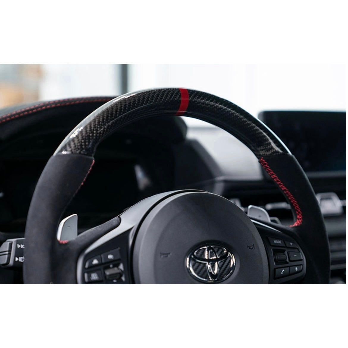 OLM 2020-2022 Toyota Supra Carbon Fiber Alcantara Pro Steering Wheel w/ Red Stripe