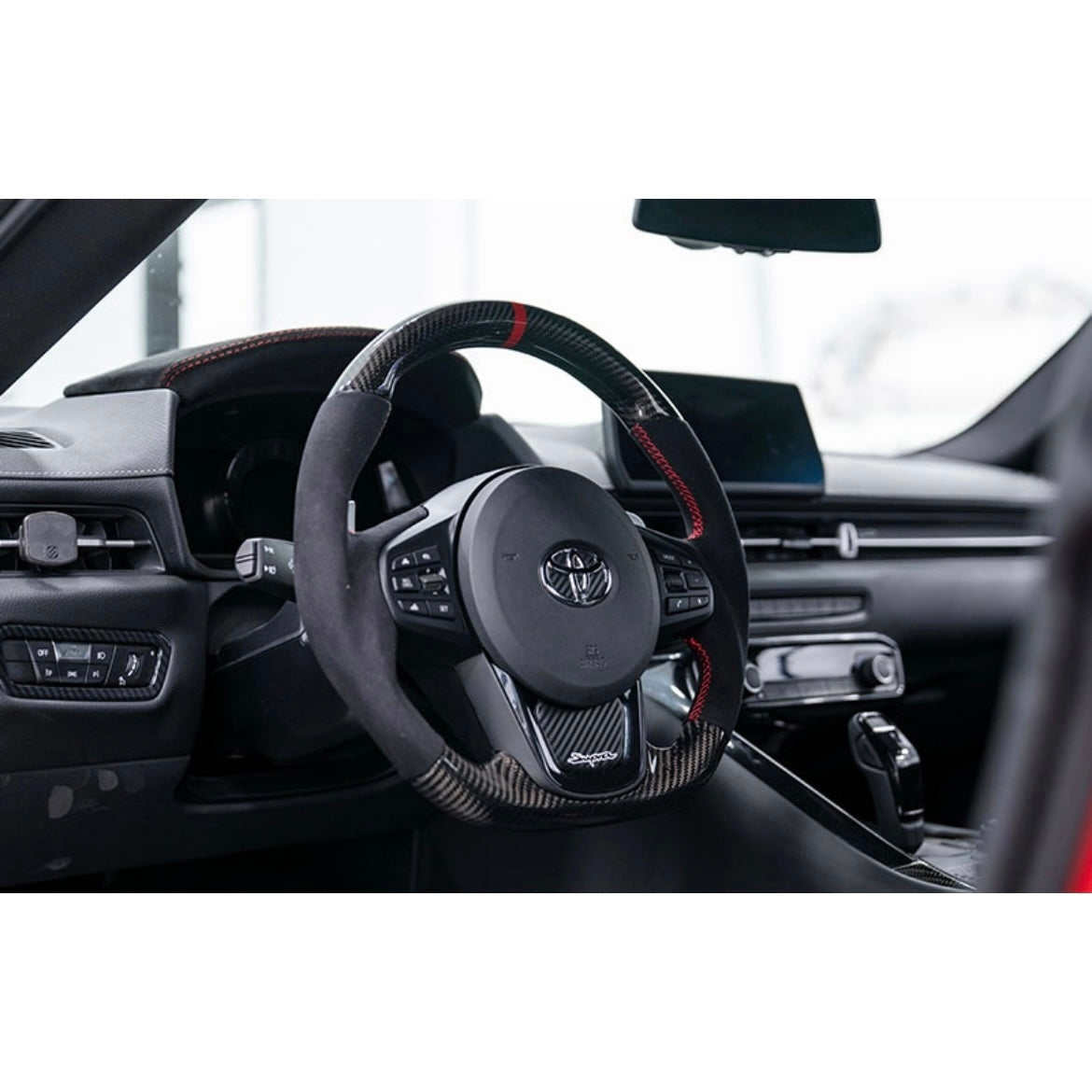 OLM 2020-2022 Toyota Supra Carbon Fiber Alcantara Pro Steering Wheel w/ Red Stripe